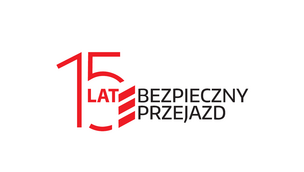 Logotyp kampanii Bezpieczny przejazd wraz z grafiką przedstawiającą liczbę 15 w której wnętrzu jest napis "lat"